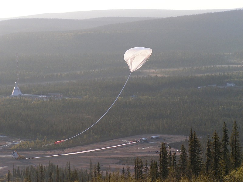 View of the release of the balloon from a nearby hill